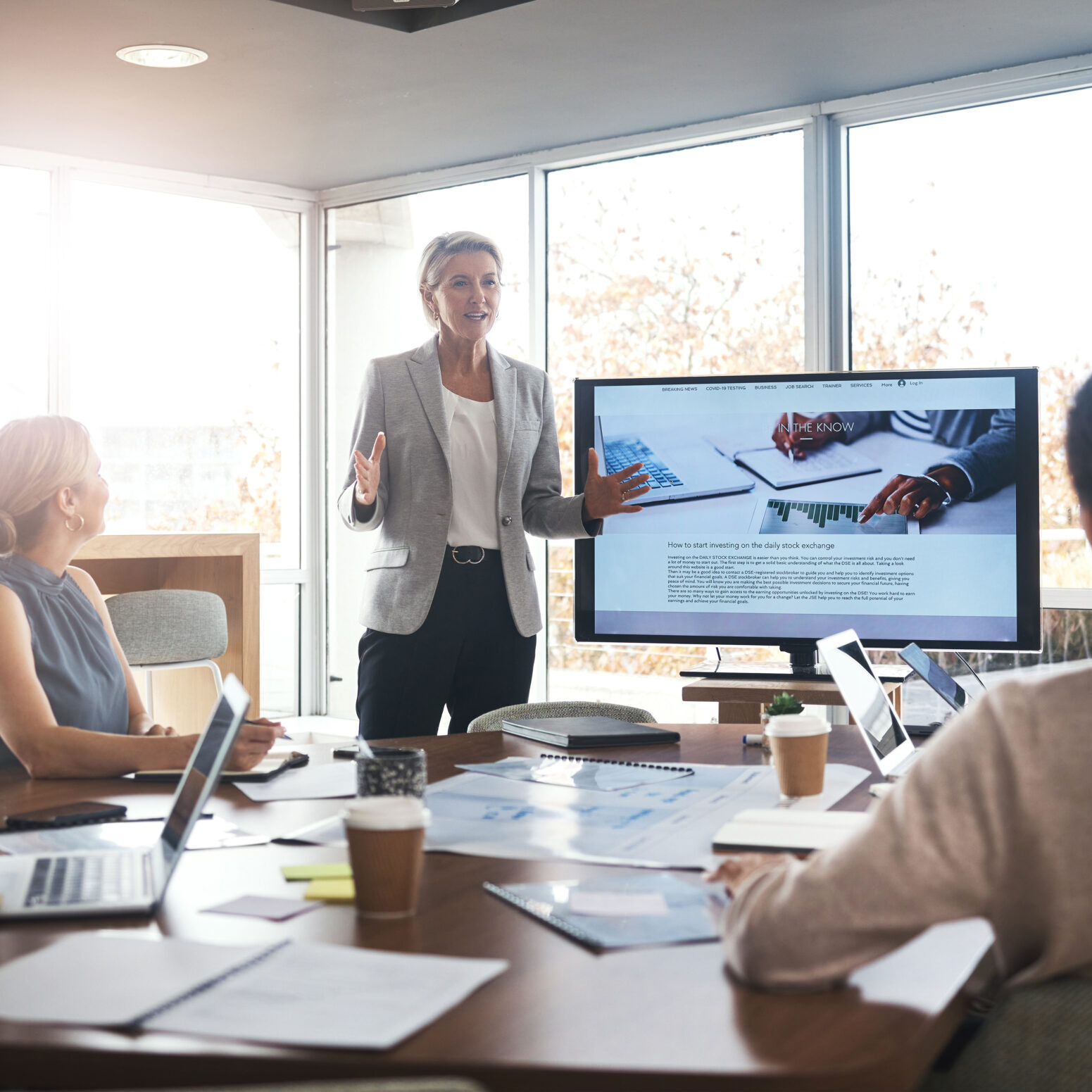 Business leader, woman and slideshow at team building seminar for company growth. Working, market research data and workshop of a female manager meeting with marketing group in office with tech.