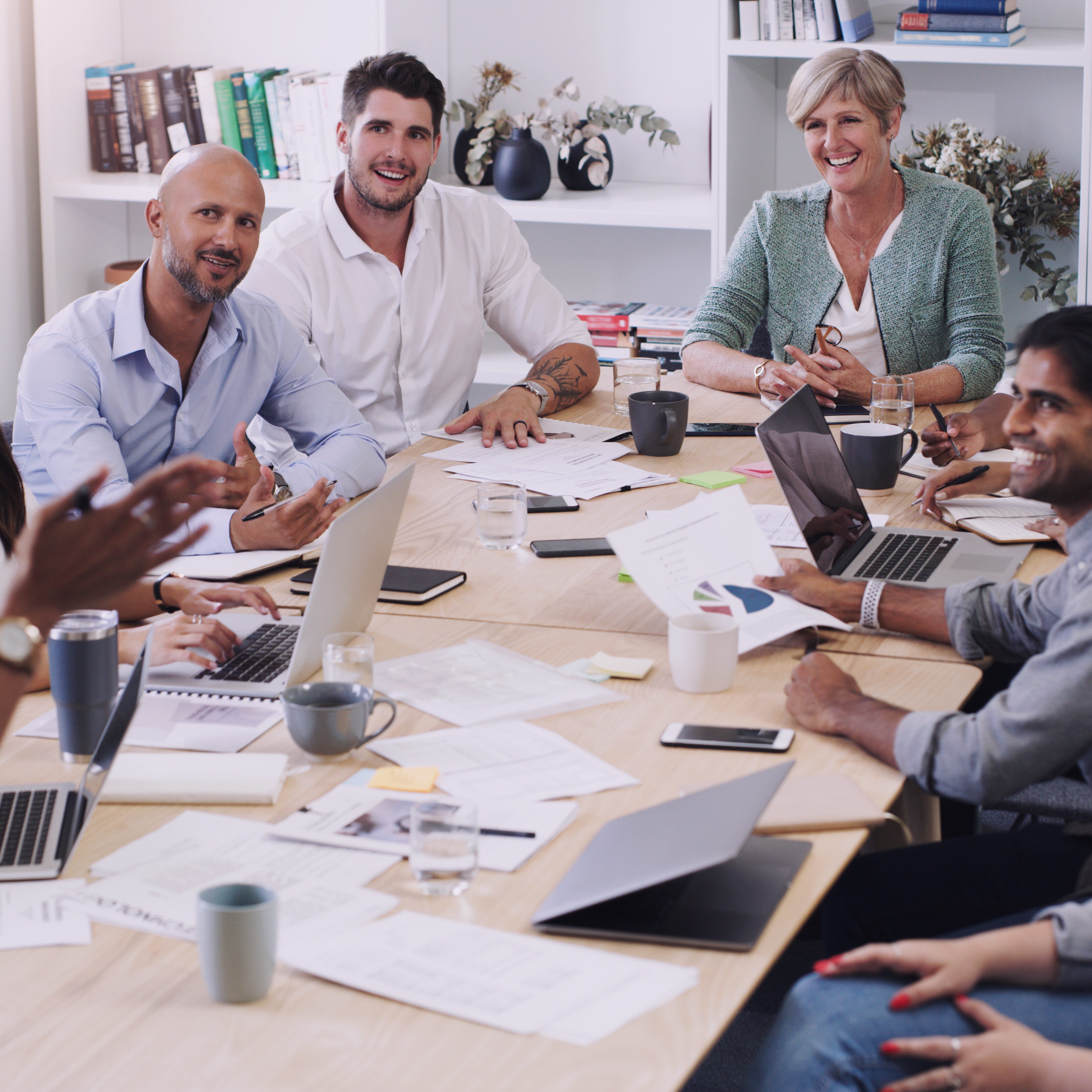 Businesspeople, presentation with leader planning and with laptop at desk in a office at their workplace. Teamwork or collaboration, business meeting and colleagues discussing together in a boardroom.